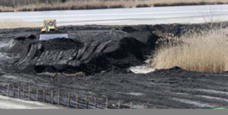 Coal ash, a byproduct of burning coal, is piled in the lower pond area before it is moved to the upper pond at the Chesterfield Power Station February 19, 2016. Eventually a cap will be placed over each pond and a new coal ash disposal site will be opened.