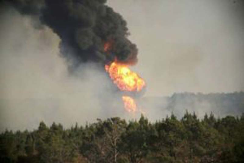 Flames shoot into the sky from a gas line explosion in western Shelby County, Alabama, U.S., October 31, 2016.