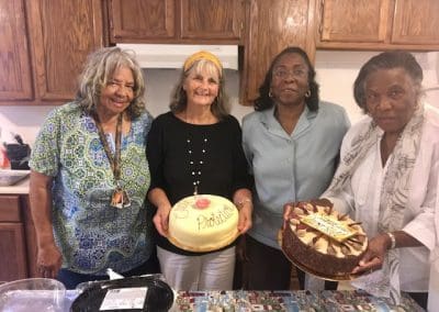 Ruby Laurie, Chad Oba, and 2 others holding cakes